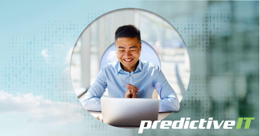Smiling IT professional using laptop with digital data background representing predictiveIT predictive analytics and smart technology solutions.