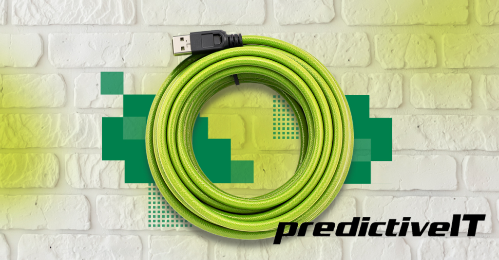 Coiled green USB cable on a white brick background with green digital design elements and predictiveIT branding.