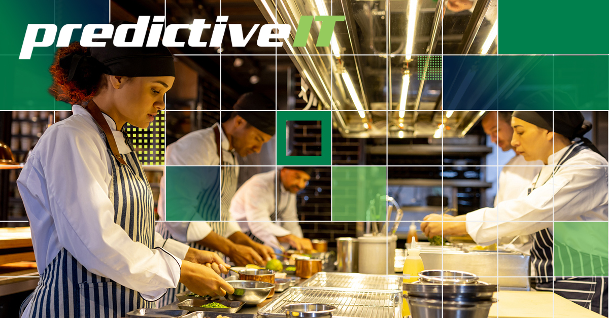 Professional chefs working in a commercial kitchen representing streamlined operations and industry-specific IT solutions by predictiveIT.