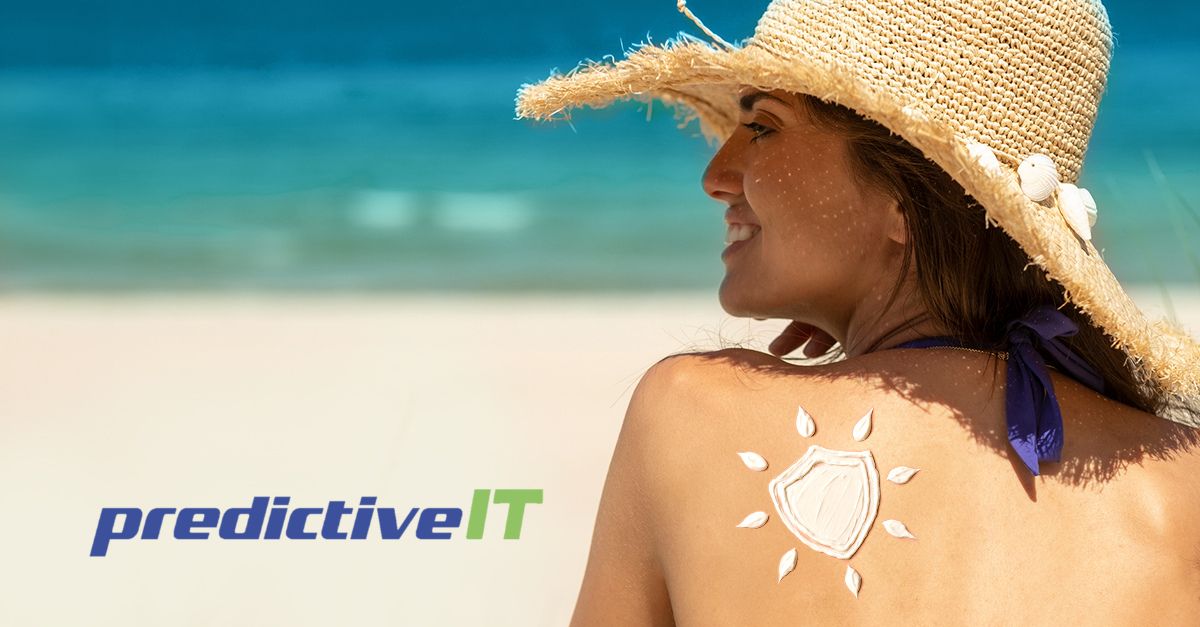 Woman wearing a straw hat relaxing on a sunny beach with sunscreen applied in a shield shape on her back, promoting UV protection and summer cybersecurity awareness by predictiveIT.