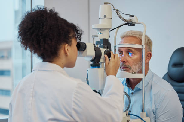 Eye doctor performing a detailed vision and eye health examination on a patient using advanced ophthalmology equipment in a modern clinic.