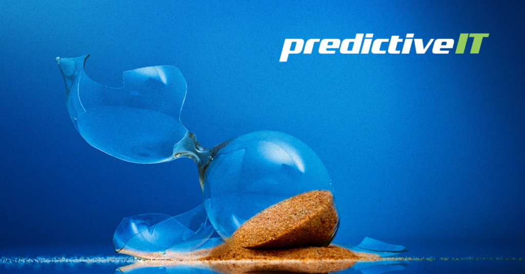 Broken hourglass with spilled sand against a blue background, symbolizing lost time, productivity challenges, business continuity, and the importance of proactive IT management. The predictiveIT logo appears in the upper corner.