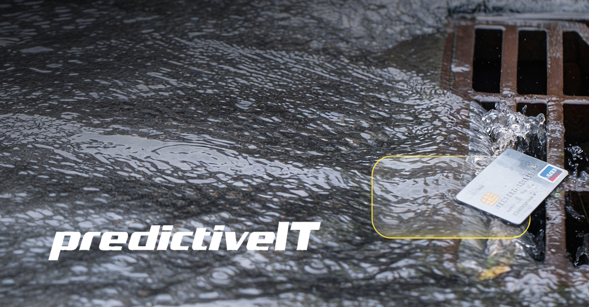 Credit card near a storm drain in heavy rain, symbolizing wasted IT spending, hidden technology costs, and opportunities to save on business IT budgets.